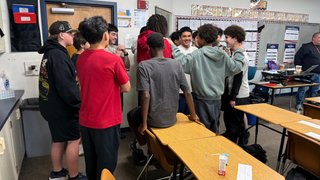 Students discuss potential solutions to a medical emergency as part of the career discovery aspect of the Mission Possible Project.
