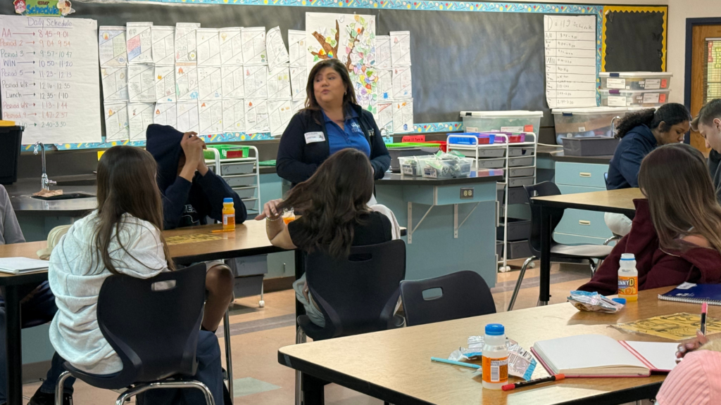 Students hear the first hand experience of adults who work in health and finance.